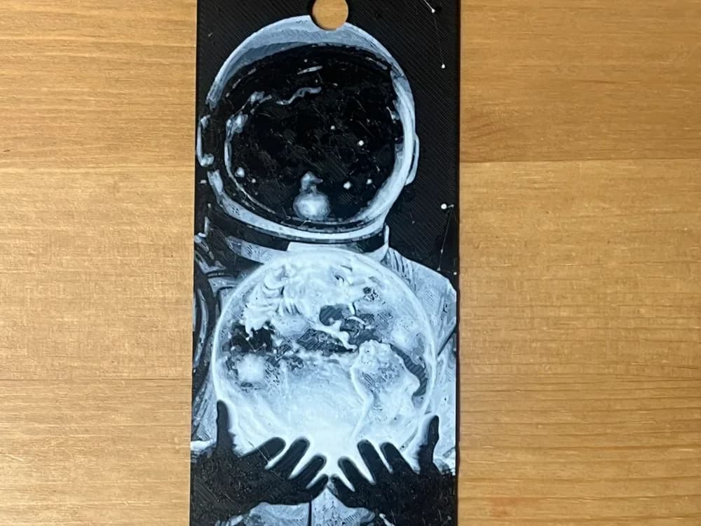 man holding the moon bookmark by Morganja HueForge model: man holding the moon bookmark by Morganja