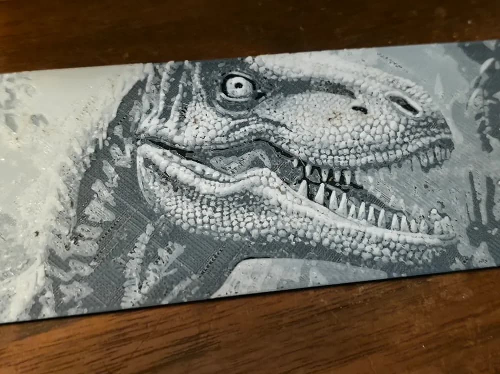 Velocoraptor Head bookmark 2 colors by AirMechDesigns HueForge model: Velocoraptor Head bookmark 2 colors by AirMechDesigns