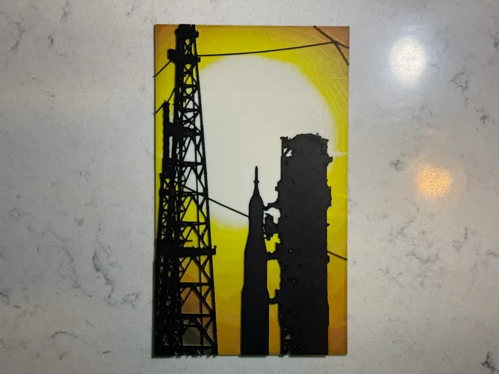 Hueforge – Artemis II Rollout at Sunset by DadMakesStuff HueForge model: Hueforge – Artemis II Rollout at Sunset by DadMakesStuff