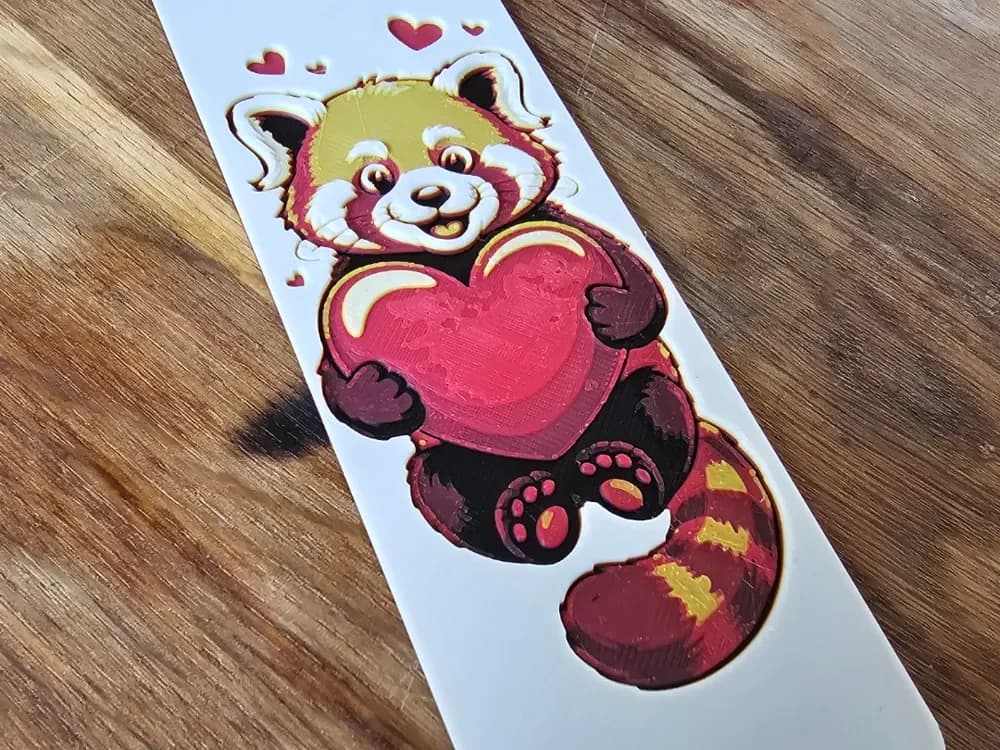 "Bookmark" of a Cute Red Panda Holding a Heart by BLUSH Designs HueForge model: "Bookmark" of a Cute Red Panda Holding a Heart by BLUSH Designs