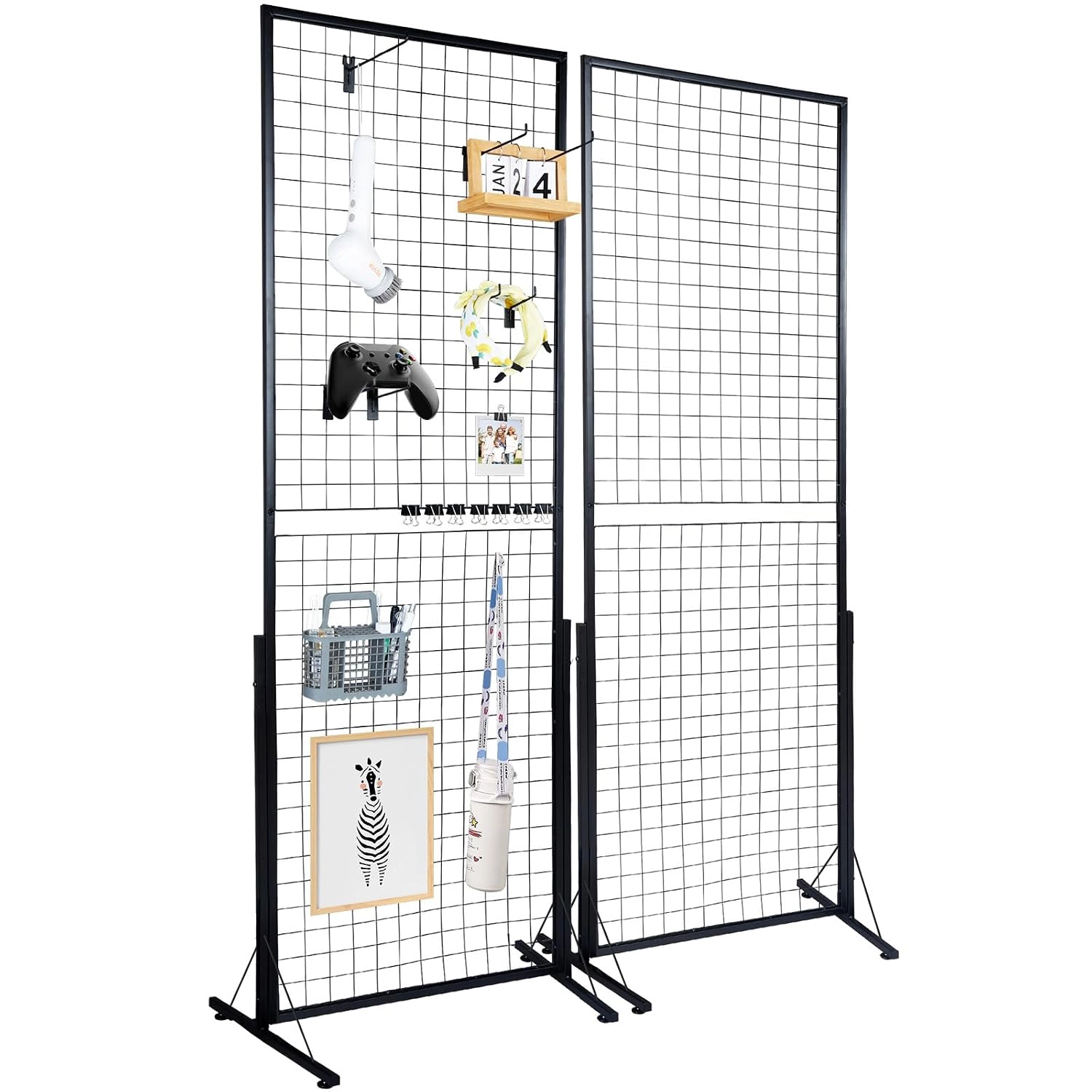 Free-standing gridwall panel display with framed prints hung on it